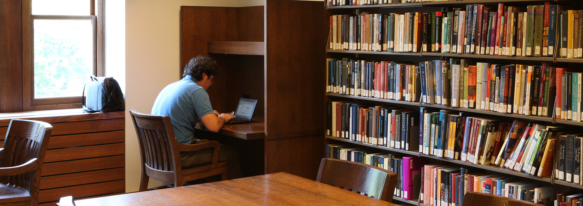 Student studying at a carrel in the John W Graham Library